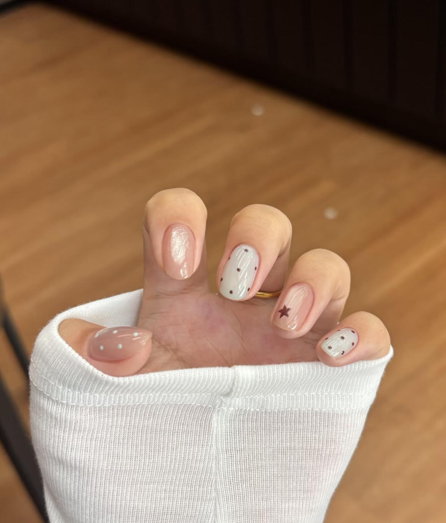 AI-generated nail designs preview showing photorealistic chrome ombre nails on a hand model