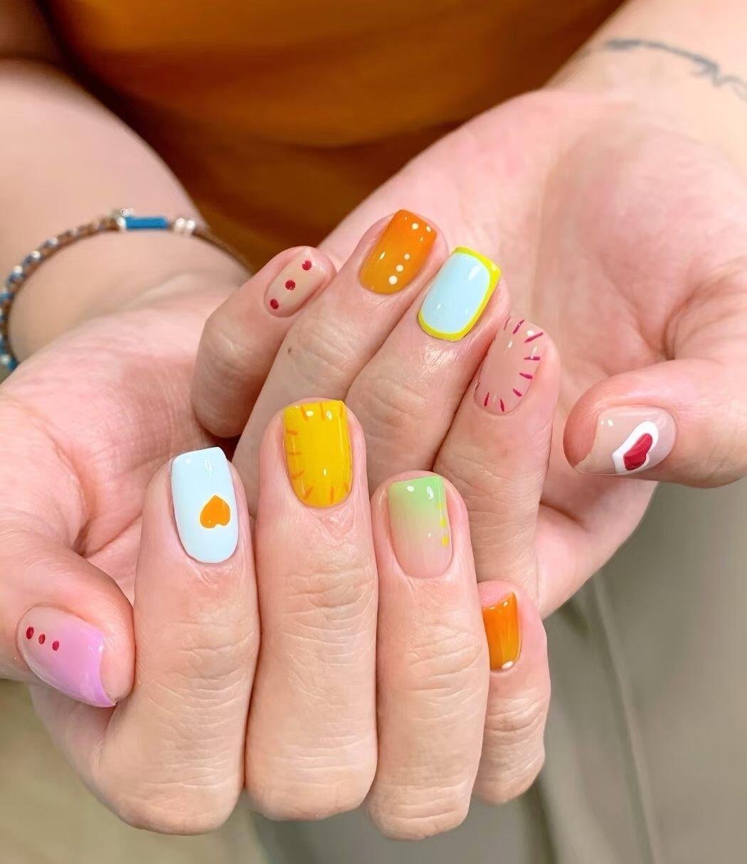 Holographic foil nail designs showing iridescent color shift on almond-shaped nails