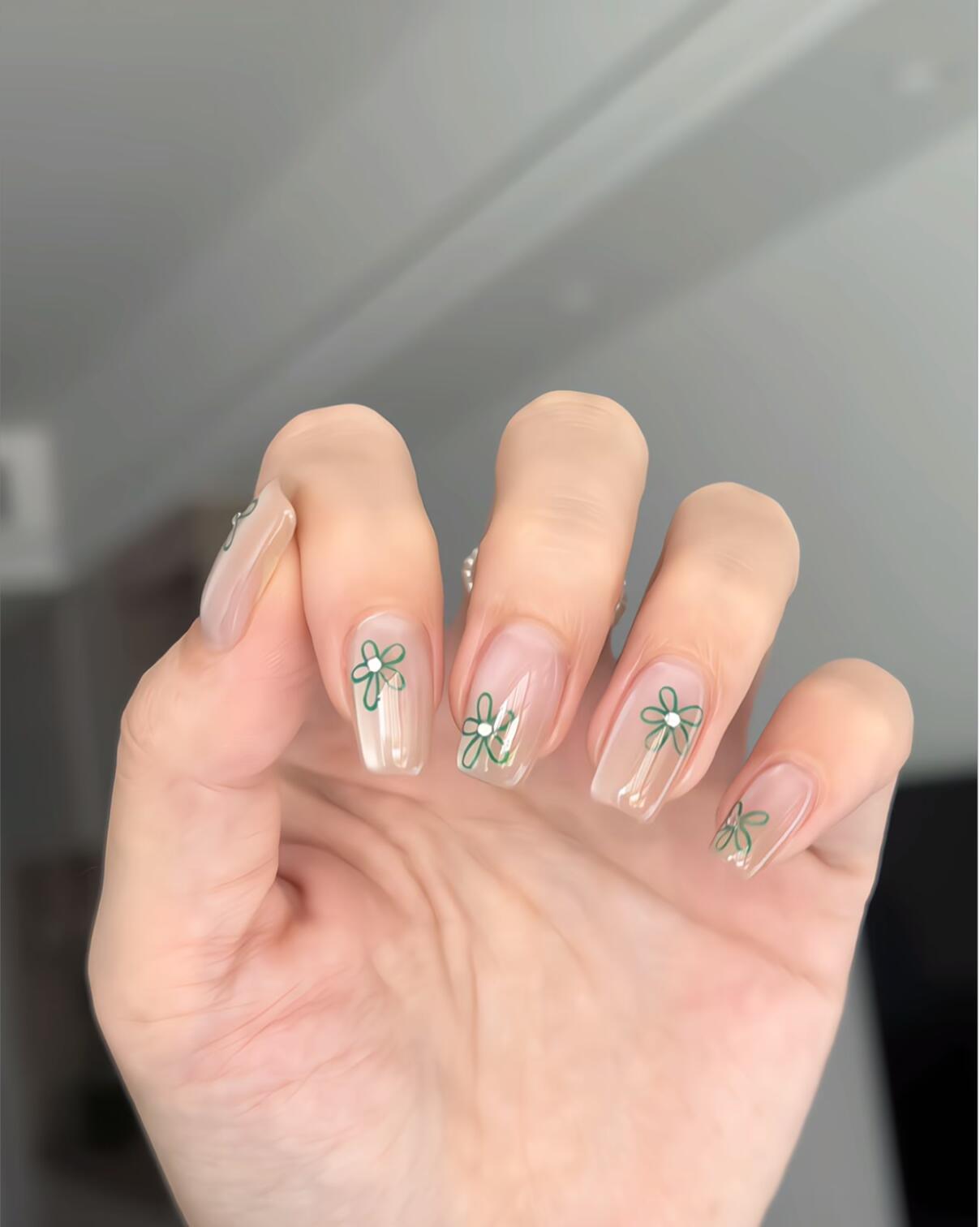 Colorful collection of nail designs displayed on a light background