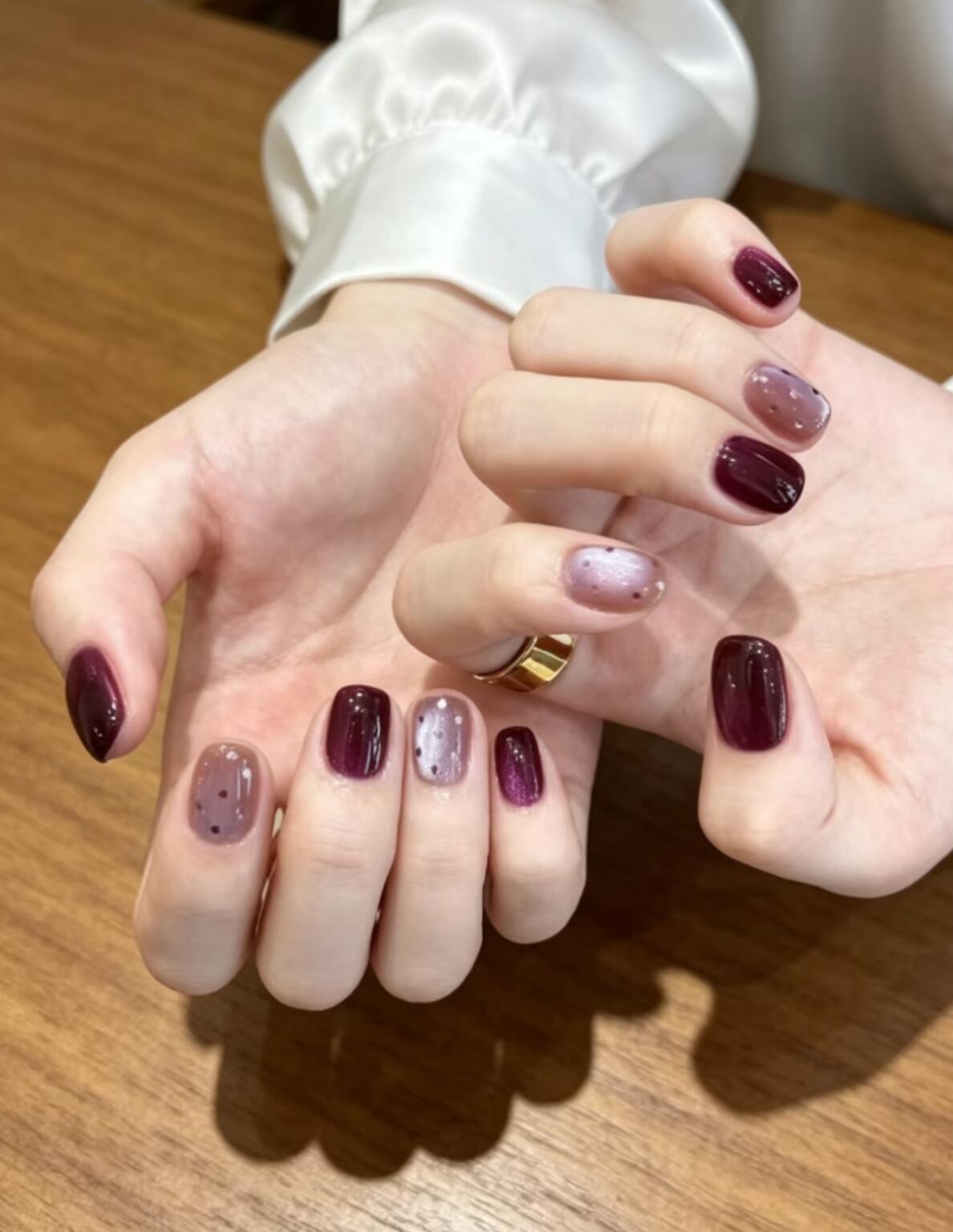 Minimalist nail designs with thin line details on a neutral background